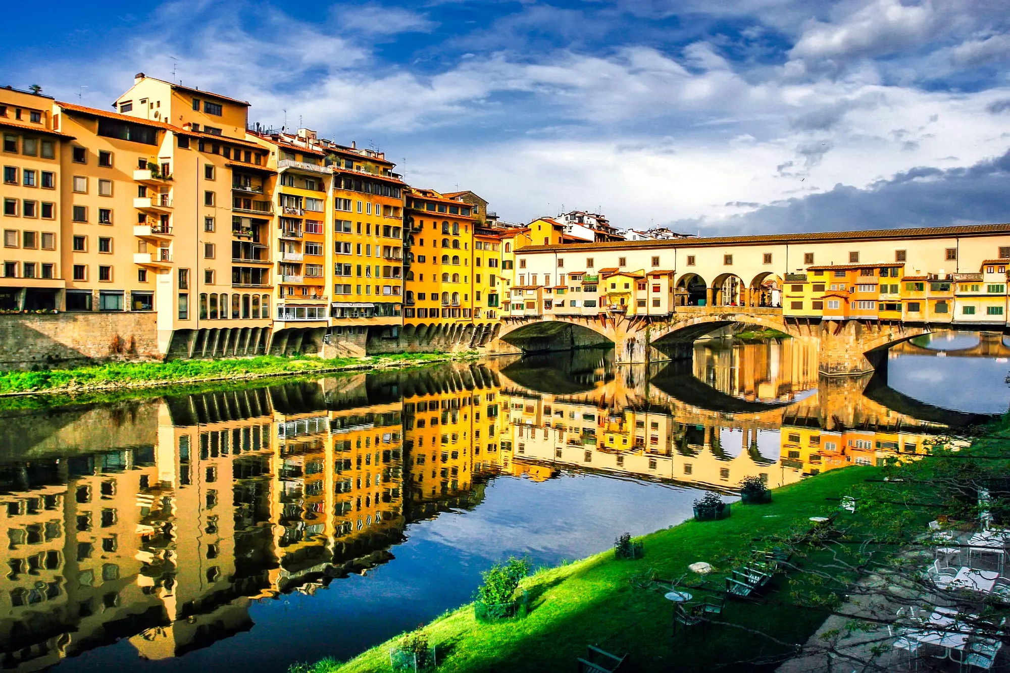 Ponte Vecchio and the riverside houses of Florence reflected in the Arno
