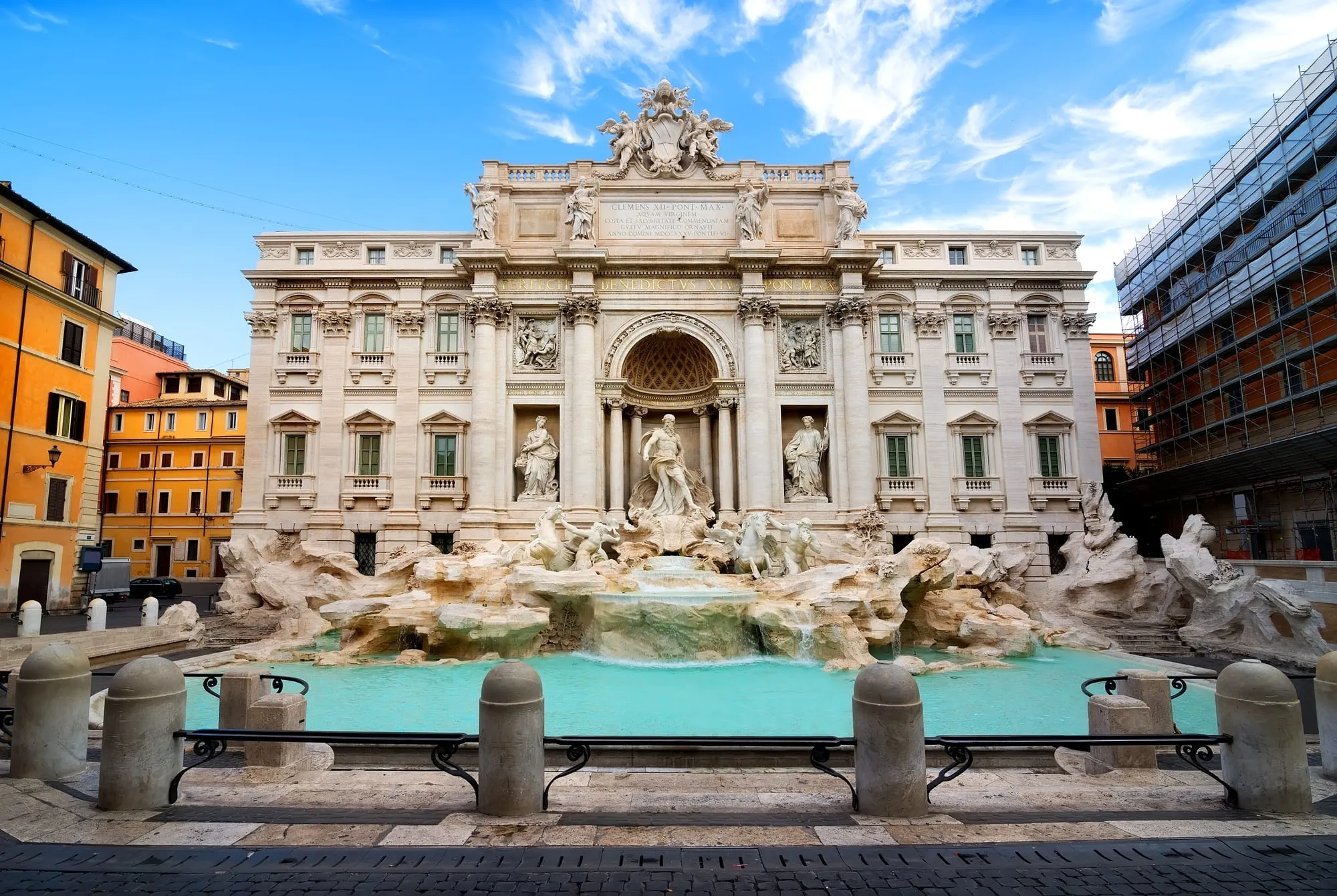 The Trevi Fountain in Rome under a clear blue sky